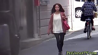 Asian babe urinating